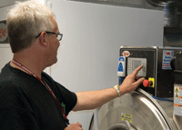 Ozone systems technician operating at an on-premise laundry facility